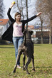 Girl Playing With Great Dane